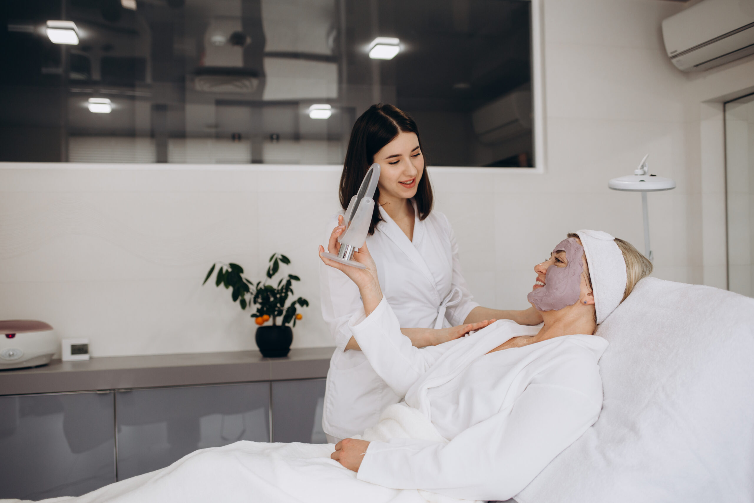 woman undergoing facial treatment 