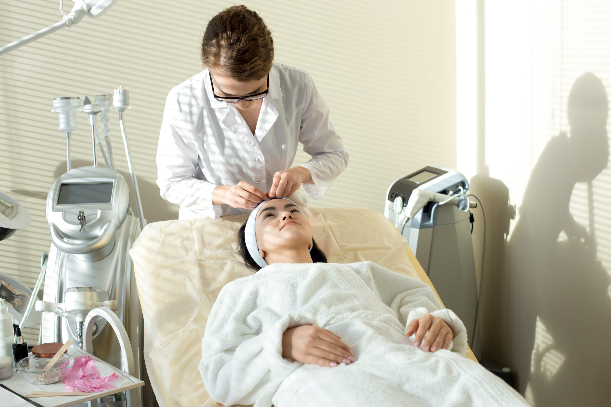woman-undergoing-facial-treatment-in-clinic